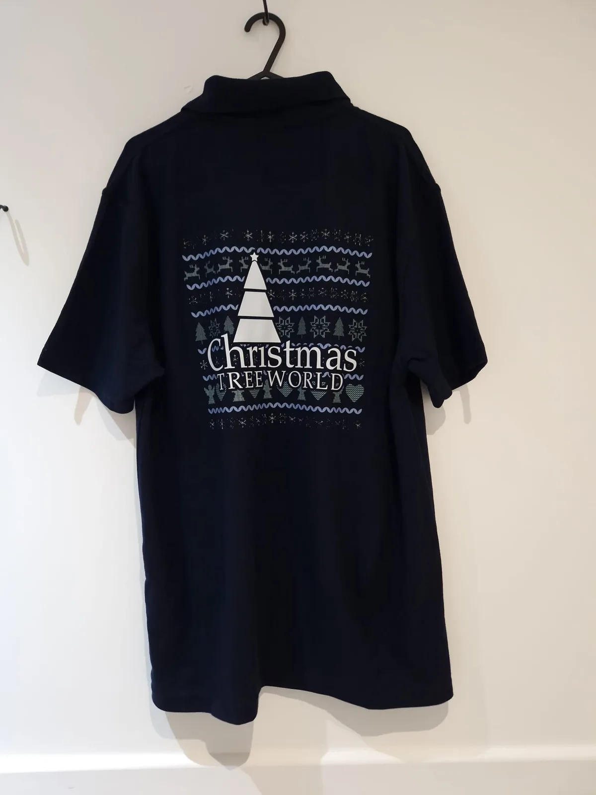 Navy polo shirt with Christmas tree back print