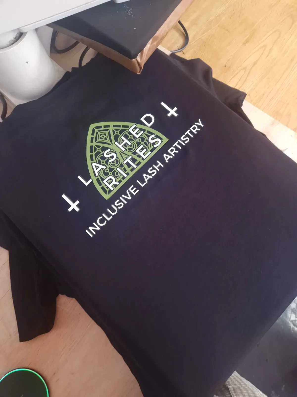 Black t-shirts with Lashed Rites lash artistry branding