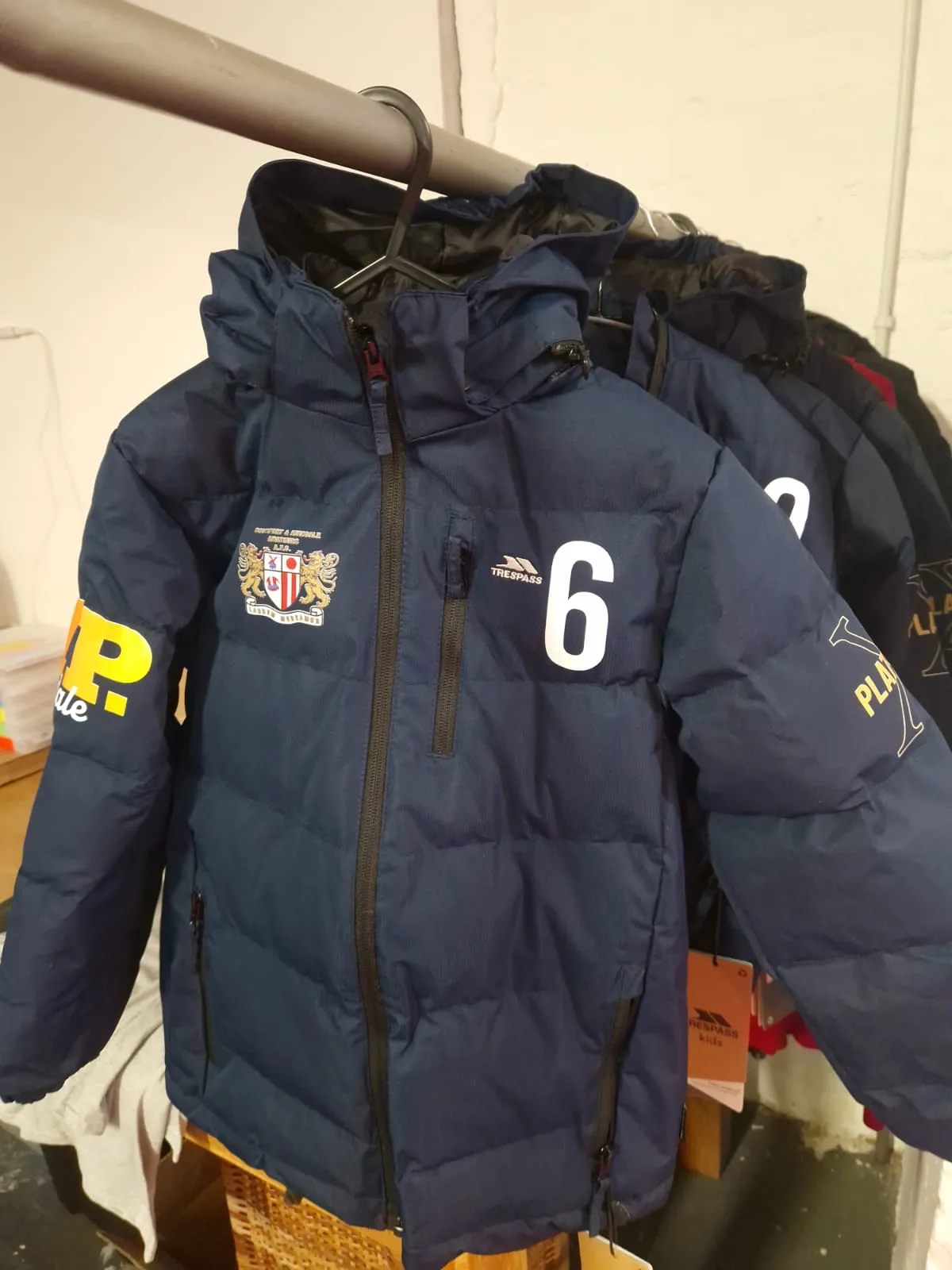 Navy padded team jackets with VIP Birkdale sponsor and squad numbers