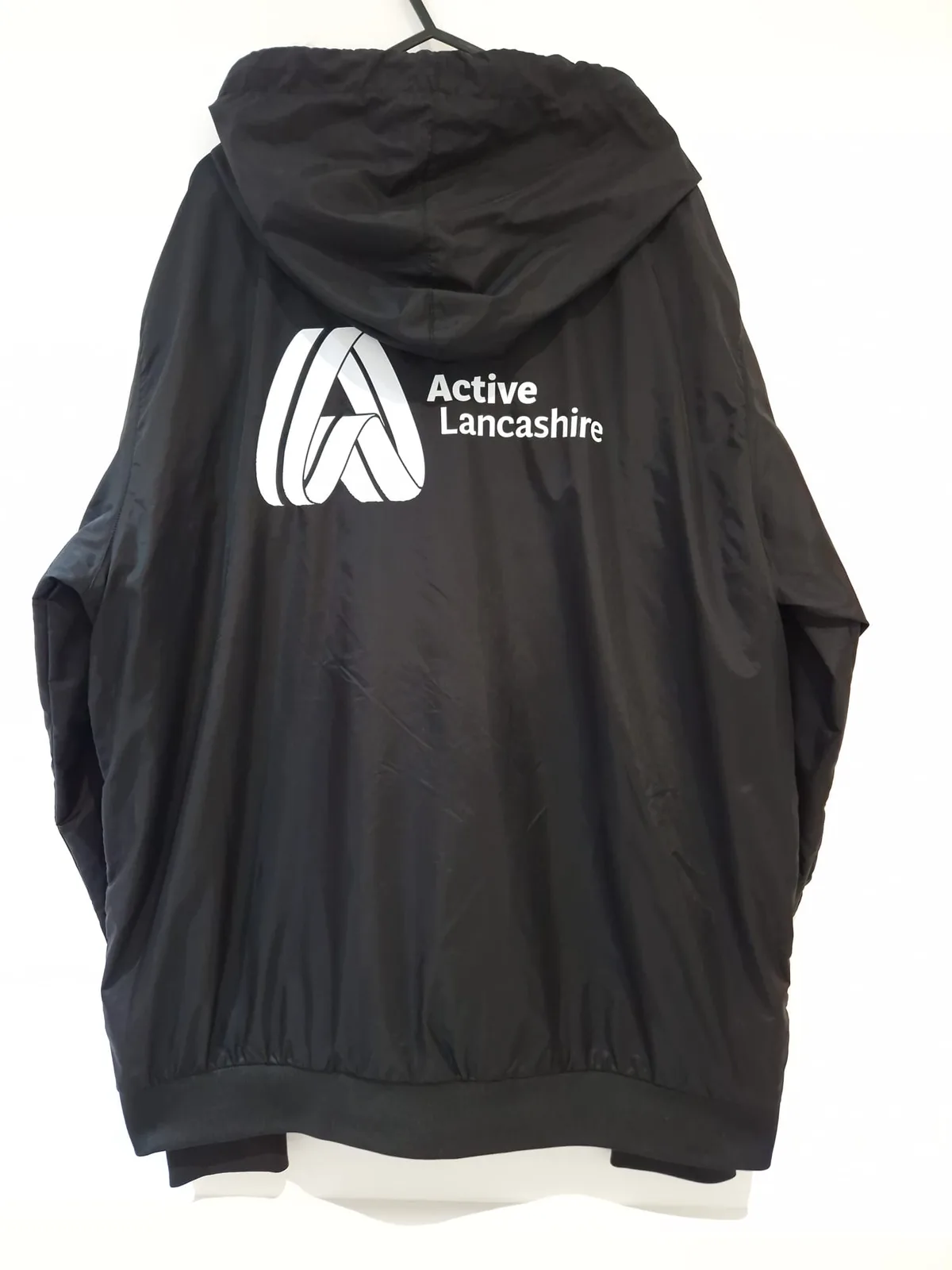 Black hooded jacket with Active Lancashire back logo