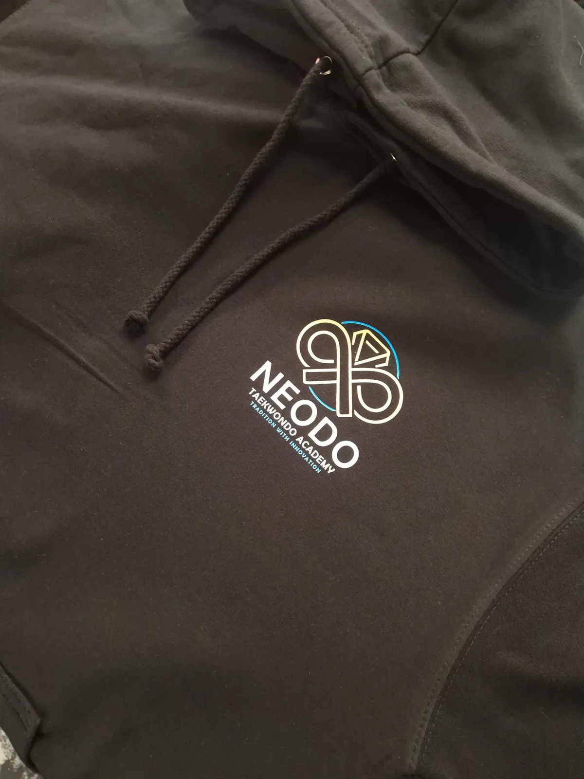 Black hoodie with NeoDo Taekwondo Academy chest logo